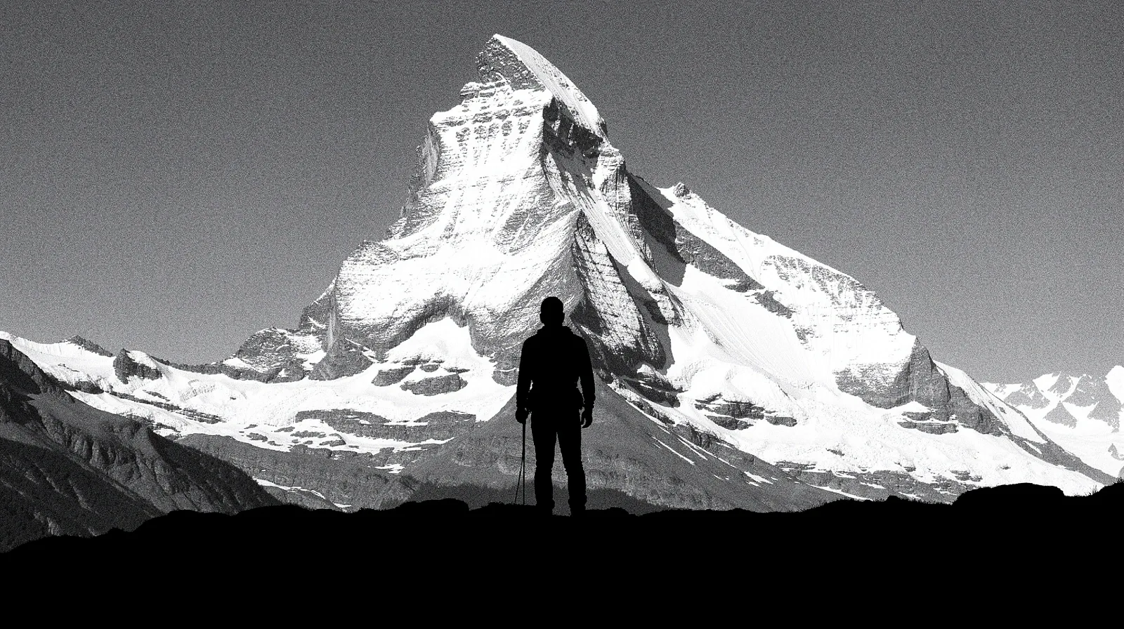 Menschliche Silhouette auf einem Schweizer Berggipfel